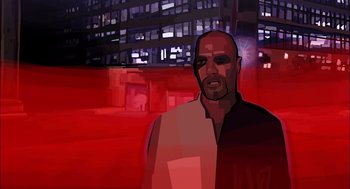 Movie still from “Waking Life” (2001), directed by Richard Linklater – An image of a man in a dark city; Wide shot, Low angle