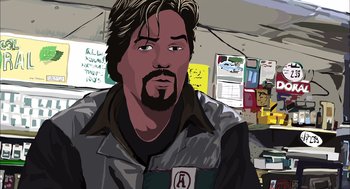 Movie still from “Waking Life” (2001), directed by Richard Linklater – A man with long hair and a beard is standing in front of a wall; Close Up shot, Overhead angle