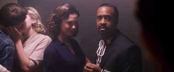 Movie still from “Walk Hard: The Dewey Cox Story” (2007), directed by Jake Kasdan – A man and a woman standing next to each other; Medium shot, Low angle