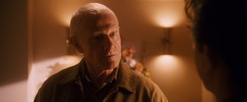 Movie still from “Walk Hard: The Dewey Cox Story” (2007), directed by Jake Kasdan – An older man is looking into the distance; Close Up shot, Over the shoulder angle