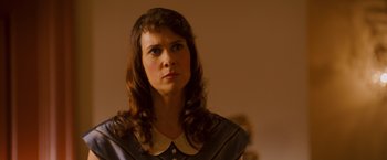 Movie still from “Walk Hard: The Dewey Cox Story” (2007), directed by Jake Kasdan – A person with long hair; Close Up shot, Over the shoulder angle