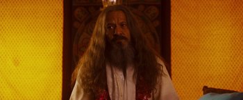 Movie still from “Walk Hard: The Dewey Cox Story” (2007), directed by Jake Kasdan – A man with long hair and a long beard; Close Up shot, Over the shoulder angle
