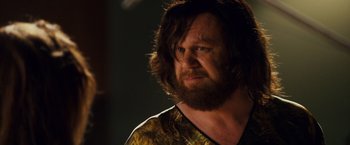 Movie still from “Walk Hard: The Dewey Cox Story” (2007), directed by Jake Kasdan – A person with long hair and a beard; Close Up shot, Over the shoulder angle