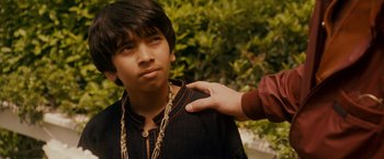 Movie still from “Walk Hard: The Dewey Cox Story” (2007), directed by Jake Kasdan – A person touching the shoulder of a young man; Close Up shot, Over the shoulder angle