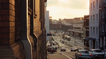 Movie still from “Walkabout” (1971), directed by Nicolas Roeg – A city street filled with lots of traffic; Extreme Wide shot, High angle