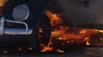Movie still from “Walkabout” (1971), directed by Nicolas Roeg – A car that is sitting on the side of the road; Extreme Close Up shot, High angle