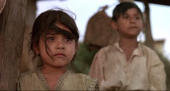 Movie still from “Walker” (1987), directed by Alex Cox – A young girl and a young boy are looking into the distance; Close Up shot, Low angle
