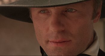Movie still from “Walker” (1987), directed by Alex Cox – A man wearing a hat; Close Up shot, Low angle