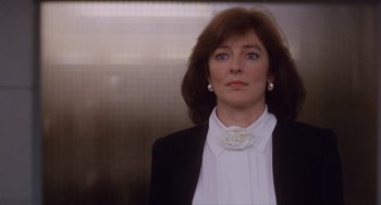 Movie still from “Wall Street” (1987), directed by Oliver Stone – A person wearing a suit and tie; Close Up shot, Low angle