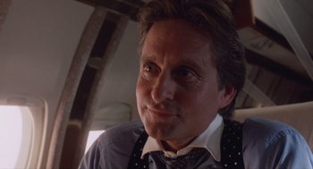 Movie still from “Wall Street” (1987), directed by Oliver Stone – A person wearing a shirt and tie; Close Up shot, Low angle