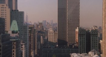 Movie still from “Wall Street” (1987), directed by Oliver Stone – A view of a large city from a high rise building; Extreme Wide shot, High angle