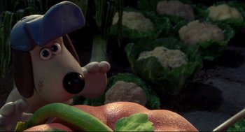 Movie still from “Wallace & Gromit: The Curse of the Were-Rabbit” (2005), directed by Nick Park – A goofy dog in a field of broccoli and cauliflower; Close Up shot, High angle