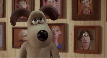 Movie still from “Wallace & Gromit: The Curse of the Were-Rabbit” (2005), directed by Nick Park – A cartoon dog with a goofy look on its face; Close Up shot, Low angle