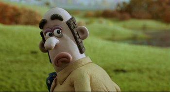 Movie still from “Wallace & Gromit: The Curse of the Were-Rabbit” (2005), directed by Nick Park – The head and face of a cartoon character; Close Up shot, Over the shoulder angle