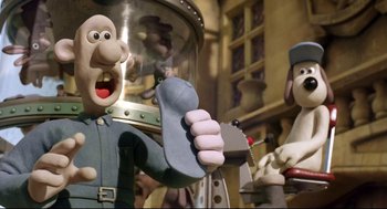 Movie still from “Wallace & Gromit: The Curse of the Were-Rabbit” (2005), directed by Nick Park – A statue of a man holding a wrench; Medium shot, Low angle