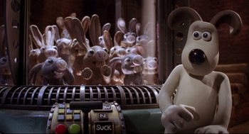 Movie still from “Wallace & Gromit: The Curse of the Were-Rabbit” (2005), directed by Nick Park – A bunch of stuffed animals in front of an atm machine; Medium shot, Low angle