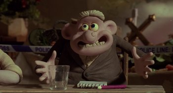 Movie still from “Wallace & Gromit: The Curse of the Were-Rabbit” (2005), directed by Nick Park – A cartoon character sitting at a table with a glass of water; Medium shot, Low angle