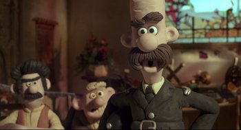 Movie still from “Wallace & Gromit: The Curse of the Were-Rabbit” (2005), directed by Nick Park – A toy character with another toy character in the background; Close Up shot, Over the shoulder angle