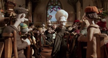 Movie still from “Wallace & Gromit: The Curse of the Were-Rabbit” (2005), directed by Nick Park – A group of people gathered in a church; Wide shot, Low angle