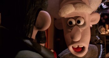 Movie still from “Wallace & Gromit: The Curse of the Were-Rabbit” (2005), directed by Nick Park – View of a fake head and face; Close Up shot, Over the shoulder angle
