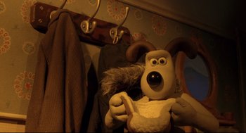 Movie still from “Wallace & Gromit: The Curse of the Were-Rabbit” (2005), directed by Nick Park – A stuffed animal is sitting on a chair; Close Up shot, Over the shoulder angle