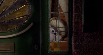 Movie still from “Wallace & Gromit: The Curse of the Were-Rabbit” (2005), directed by Nick Park – A teddy bear peeks out from a window; Extreme Close Up shot, Low angle