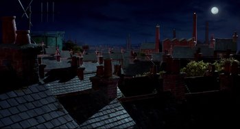 Movie still from “Wallace & Gromit: The Curse of the Were-Rabbit” (2005), directed by Nick Park – A view of a city rooftops at night time; Extreme Wide shot, High angle
