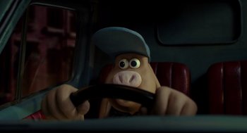Movie still from “Wallace & Gromit: The Curse of the Were-Rabbit” (2005), directed by Nick Park – A person in a car with a steering wheel; Close Up shot, High angle