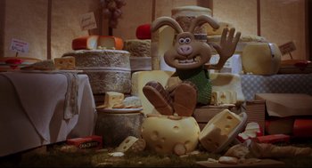 Movie still from “Wallace & Gromit: The Curse of the Were-Rabbit” (2005), directed by Nick Park – A toy rabbit sitting on top of a pile of cheese; Wide shot, High angle