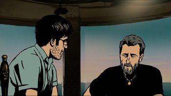Movie still from “Waltz with Bashir” (2008), directed by Ari Folman – Two men are sitting in a room and one of them has a beard; Medium shot, Over the shoulder angle