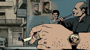 Movie still from “Waltz with Bashir” (2008), directed by Ari Folman – A hand holding a cigarette in front of a man; Medium shot, Over the shoulder angle