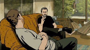 Movie still from “Waltz with Bashir” (2008), directed by Ari Folman – Two men are sitting on a couch and one is lying down; Medium shot, High angle