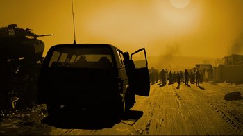 Movie still from “Waltz with Bashir” (2008), directed by Ari Folman – A group of people standing next to a van on the side of a road; Extreme Wide shot, Low angle