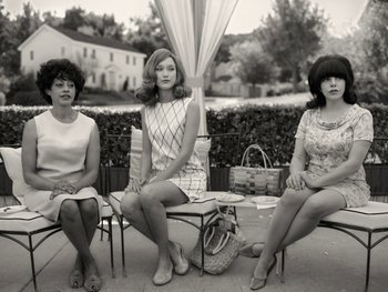 Movie still from “WandaVision” (2021), directed by Matt Shakman – A group of three women sitting on a bench; Wide shot, Low angle