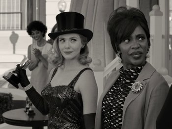 Movie still from “WandaVision” (2021), directed by Matt Shakman – A group of women standing next to each other; Medium shot, Over the shoulder angle