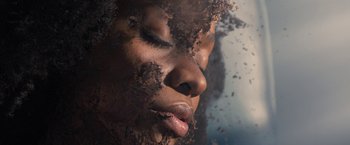 Movie still from “WandaVision” (2021), directed by Matt Shakman – A woman's face with dirt on her face; Extreme Close Up shot, Overhead angle