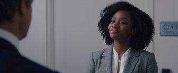 Movie still from “WandaVision” (2021), directed by Matt Shakman – A woman in a gray jacket and a white shirt; Close Up shot, Over the shoulder angle