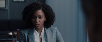 Movie still from “WandaVision” (2021), directed by Matt Shakman – A woman in a gray jacket and a white shirt; Close Up shot, Over the shoulder angle