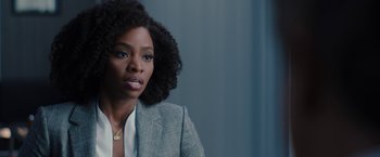Movie still from “WandaVision” (2021), directed by Matt Shakman – A woman in a gray jacket and a white shirt; Close Up shot, Over the shoulder angle