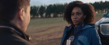 Movie still from “WandaVision” (2021), directed by Matt Shakman – A woman standing in front of a field; Close Up shot, Over the shoulder angle