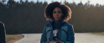 Movie still from “WandaVision” (2021), directed by Matt Shakman – A woman holding a cell phone in her hands; Close Up shot, Over the shoulder angle