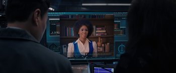 Movie still from “WandaVision” (2021), directed by Matt Shakman – A woman with a large afro is on a computer screen; Close Up shot, Over the shoulder angle