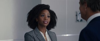 Movie still from “WandaVision” (2021), directed by Matt Shakman – A woman in a gray jacket and a white shirt; Close Up shot, Over the shoulder angle