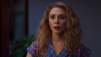 Movie still from “WandaVision” (2021), directed by Matt Shakman – A person with long hair; Close Up shot, Over the shoulder angle