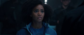 Movie still from “WandaVision” (2021), directed by Matt Shakman – A person wearing a blue jacket; Close Up shot, Over the shoulder angle