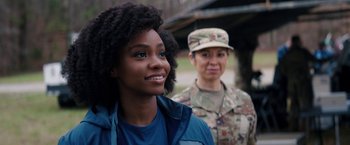 Movie still from “WandaVision” (2021), directed by Matt Shakman – A woman standing next to a woman in a military uniform; Close Up shot, Over the shoulder angle