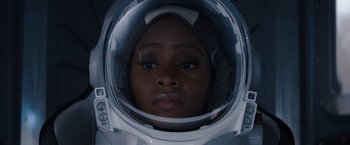Movie still from “WandaVision” (2021), directed by Matt Shakman – A woman wearing a space helmet looking into the camera; Close Up shot, Overhead angle