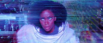 Movie still from “WandaVision” (2021), directed by Matt Shakman – A black woman with blue eyes looking at the camera; Close Up shot, High angle