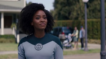 Movie still from “WandaVision” (2021), directed by Matt Shakman – A woman standing in front of a group of people; Close Up shot, Over the shoulder angle