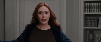 Movie still from “WandaVision” (2021), directed by Matt Shakman – A person with long red hair; Close Up shot, Over the shoulder angle